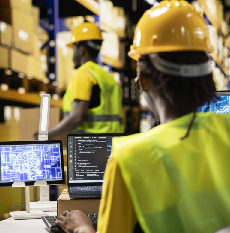 Female warehouse staff overseeing order fulfillment with AI brain support, working on e-commerce in industrial warehouse with huge racks. Artificial intelligence neural networks on screens.